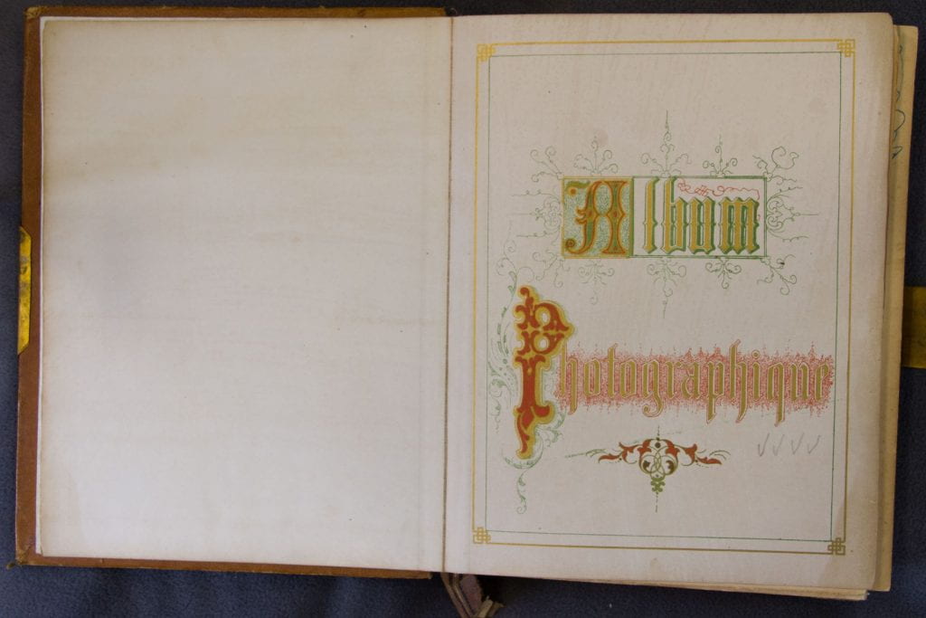 Album half title page - elaborate hand typography in red, green and gold: Album Photographique