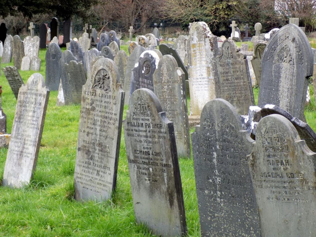 Rows and rows of headstones tilting at different angles