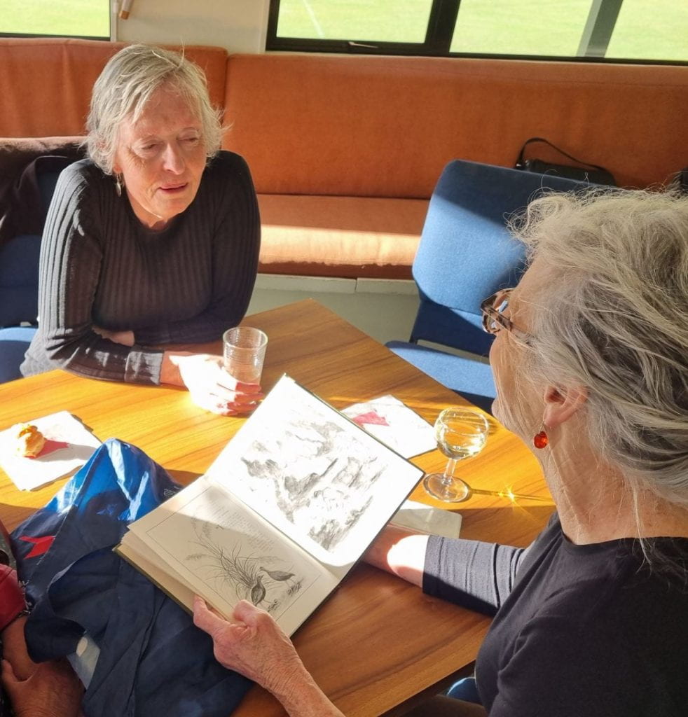 Michele Leggott and Susan Davis discussing Emily's Fairyland illustrations